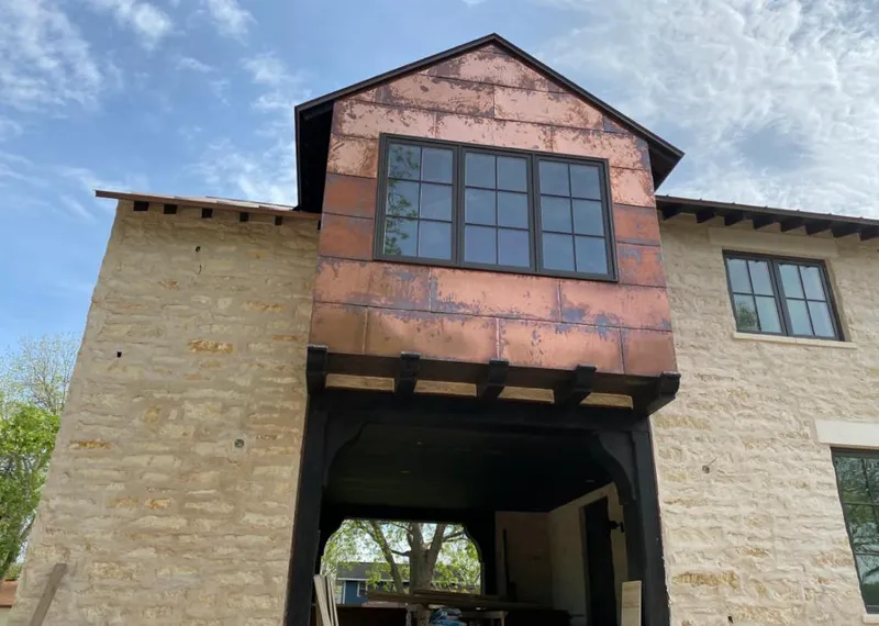 Copper metal panel facade on a stone building for Metal Roof Coating in Helena